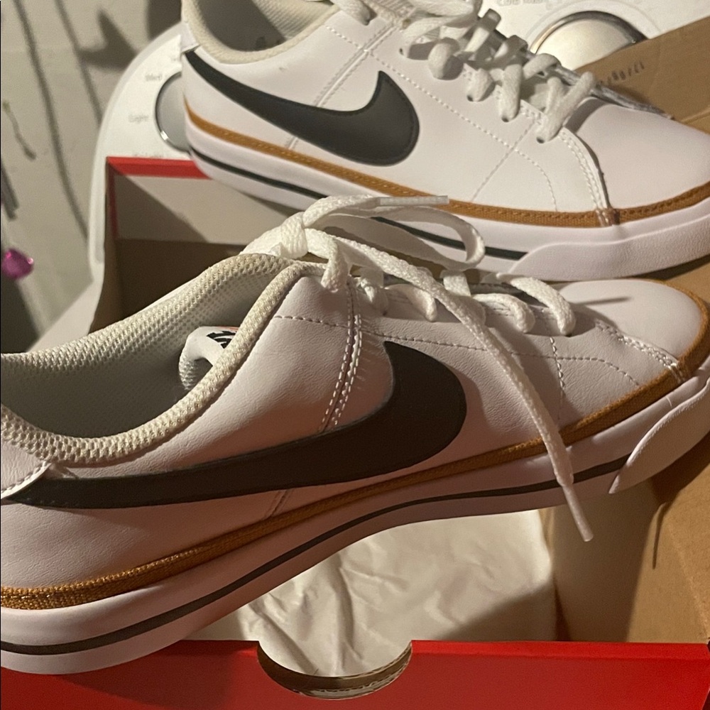 Nike White and Black Sneakers with desert ochre accentaround .